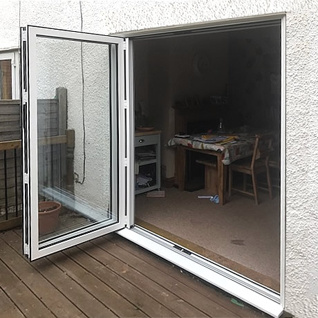 A 2 pane Smart Aluminium bi-folding door finished in White installed in solihull, www.solihullwindows.co.uk