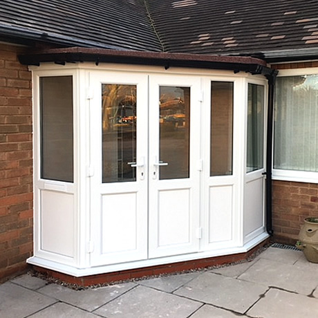 Newbuild angled entrance porch built and installed with French doors and flat felted roof located in Solihull