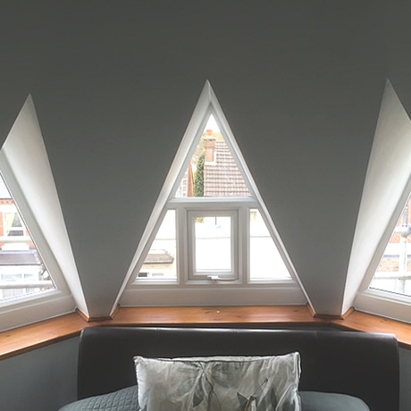 Double glazed triangular shaped windows installed at high-level in birmingham, www.solihullwindows.co.uk