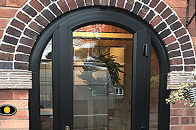 Arched entrance porch in all black Liniar woodgrain profile by Solihull WDC